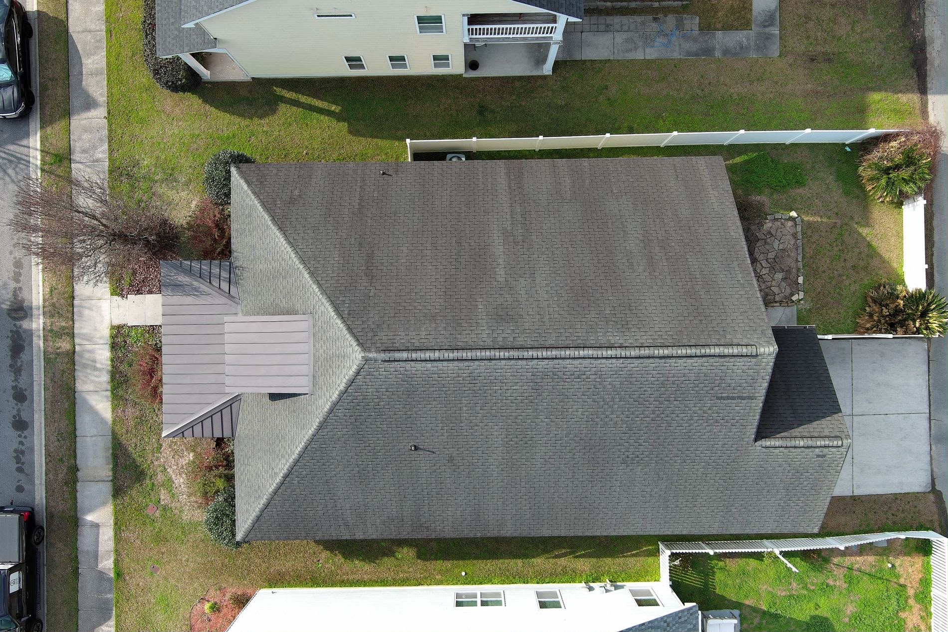 AFTER: A clean, uniform, freshly installed shingle roof — the result of a proactive roof replacement completed before storm damage or a roof leak could occur.