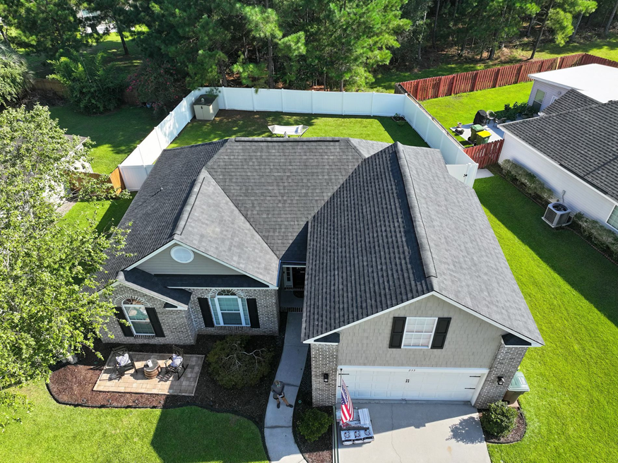 A completed roof replacement project — aerial view of the full property.
